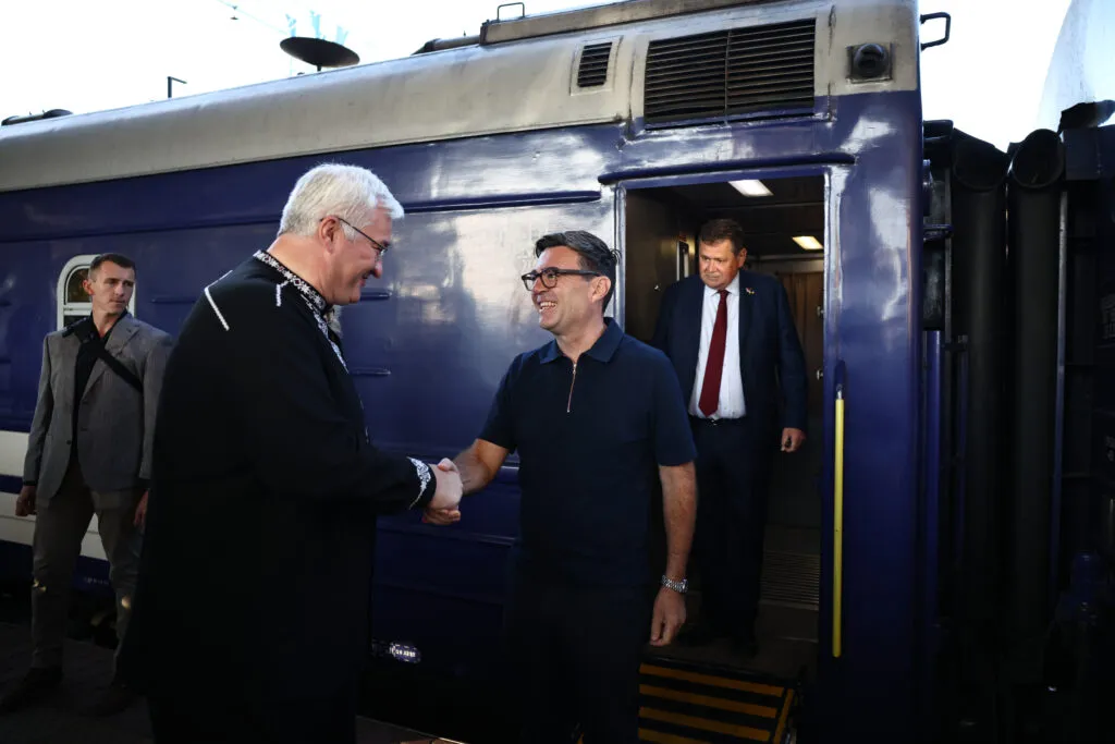 Ukraine’s foreign minister greets a visiting British official in Kyiv