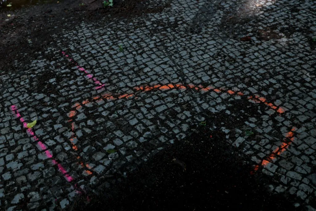 Investigation marks on the ground near the scene of the attack.