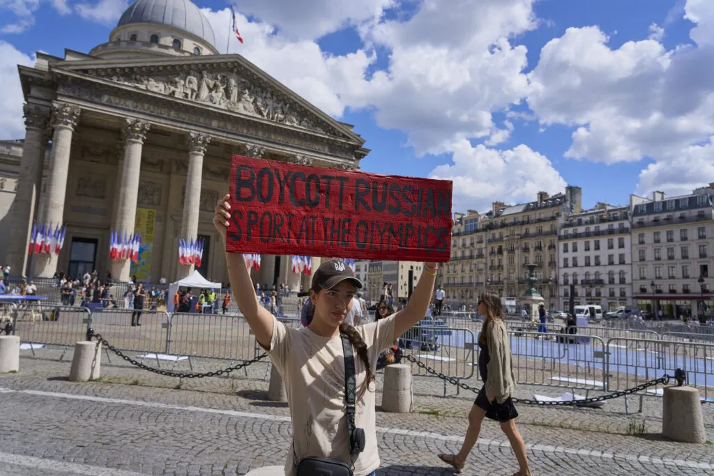 A march in Paris calling for boycott of Russian sport — a scene captured amid Western protests.