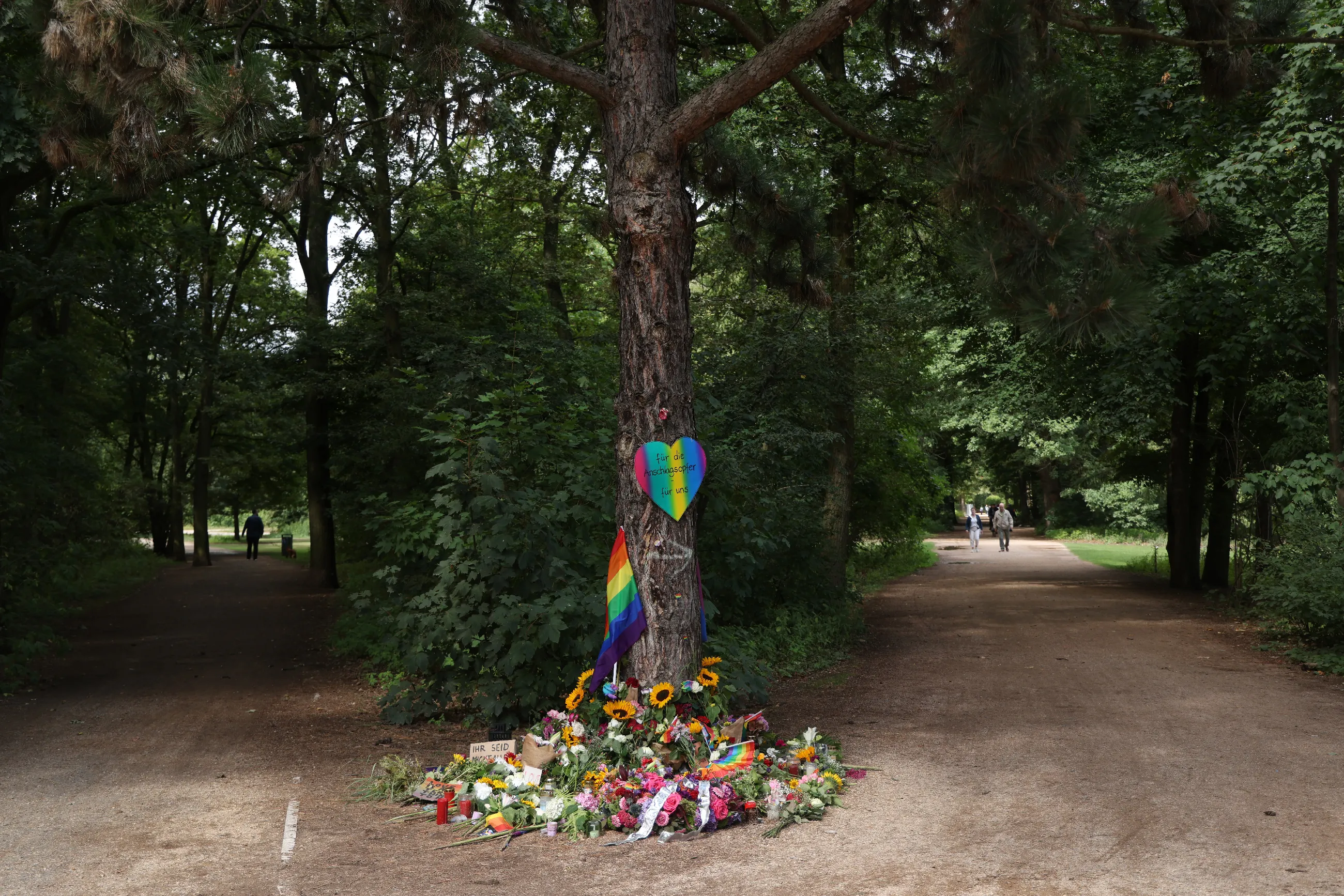 Flowers and candles at a makeshift memorial in Tiergarten park on July 27, 2026.